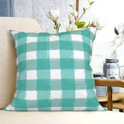 Teal buffalo plaid short-pile plush Easter pillow cover styled on a chair