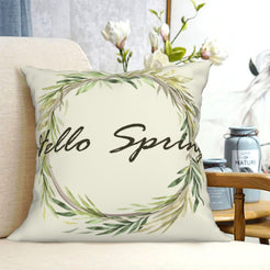 Cream Hello Spring wreath short-pile plush pillow cover styled on a chair