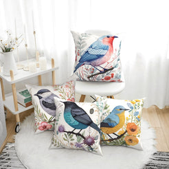 short-pile plush polyester pillow covers with colorful birds among flowers and berries, arranged beside a white chair