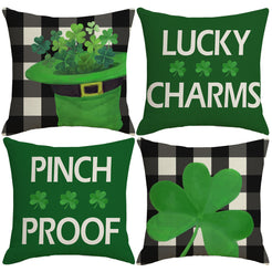 Set of four short-pile plush pillow covers with black gingham, shamrocks and Lucky Charms text