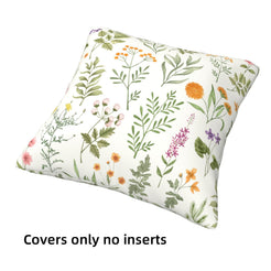 short-pile plush polyester pillow cover with delicate green herbs and colorful wildflowers, shown at an angle on white