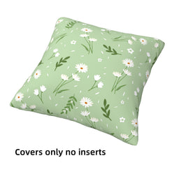 short-pile plush polyester pillow cover with small white daisies and leafy sprigs on sage, shown at an angle on white