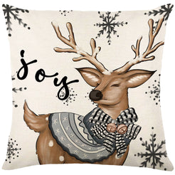 Linen-look polyester pillow cover with winter deer with Joy lettering, shown on white