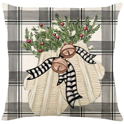 Linen-look polyester pillow cover with white pumpkins and greenery on gray plaid, shown on white
