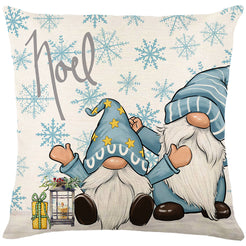 Linen-look polyester pillow cover with two winter gnomes and Noel lettering, shown on white
