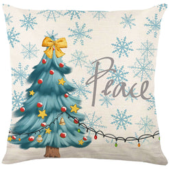 Linen-look polyester pillow cover with decorated Christmas tree and Peace lettering, shown on white