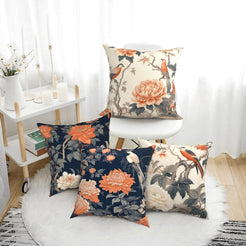 Short-pile plush pillow covers with peonies, cranes and branches in cream and navy, styled in a bright room