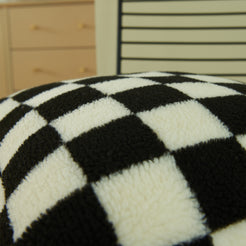 Close-up of soft black and white checkerboard faux fur texture