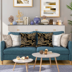 velvet polyester pillow covers with gold mountain and pagoda landscape on black, styled on a teal sofa