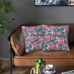 Velvet pillow covers with pink roses with black-and-white tigers, styled on a sofa