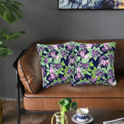Velvet pillow covers with black and pink tigers with flowers, styled on a sofa