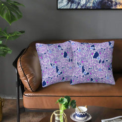 Velvet pillow covers with lavender abstract animal pattern, styled on a sofa
