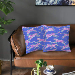 Velvet pillow covers with periwinkle pink leopards, styled on a sofa