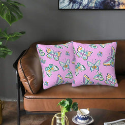 Velvet pillow covers with pink butterflies, styled on a sofa