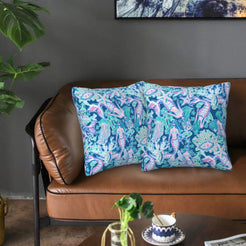 Velvet pillow covers with blue and purple sea life pattern, styled on a sofa