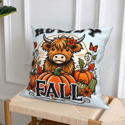 Light blue fall pillow cover from the highland cow, pumpkin spice, harvest and raccoon designs set, styled on a chair