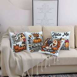 Four light blue fall pillow covers with Pumpkin Queen and retro fall designs, styled on a sofa