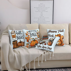 Four light blue fall pillow covers with Welcome Fall, books and squirrel designs, styled on a sofa