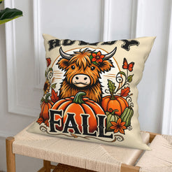 Cream fall pillow cover from the highland cow, pumpkin spice, harvest and raccoon designs set, styled on a chair