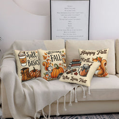 Four cream fall pillow covers with Welcome Fall, books and squirrel designs, styled on a sofa