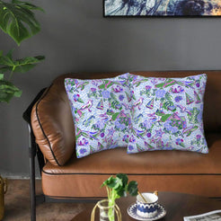 Velvet pillow covers with lavender hydrangeas and coastal motifs, styled on a sofa