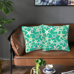 Velvet pillow covers with teal starfish, styled on a sofa