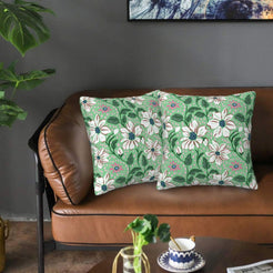 Velvet pillow covers with sage white daisies, styled on a sofa