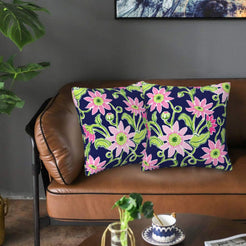 Velvet pillow covers with navy pink flowers, styled on a sofa