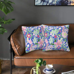 Velvet pillow covers with navy pastel mixed florals, styled on a sofa