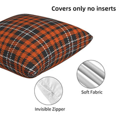 Hidden zipper and velvet detail on a pillow cover with orange, black and white houndstooth plaid