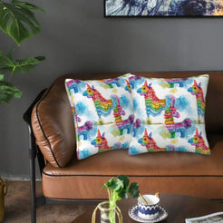 Mexican-inspired velvet pillow covers with colorful donkey piñatas, styled on a brown leather sofa