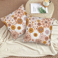 Halloween velvet pillow covers with cream dense autumn florals, styled on a woven chair