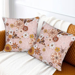 Halloween velvet pillow covers with blush spiderwebs and dahlias, styled on a sofa