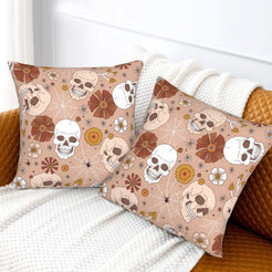 Halloween velvet pillow covers with blush skulls and flowers, styled on a sofa