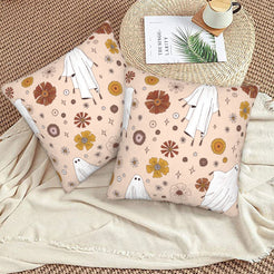 Halloween velvet pillow covers with blush ghosts and flowers, styled on a woven chair