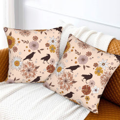 Halloween velvet pillow covers with blush ravens, moons and flowers, styled on a sofa
