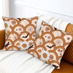 Halloween velvet pillow covers with blush retro arches, bats and daisies, styled on a sofa