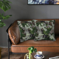 Velvet pillow covers with gray and green camouflage, styled on a sofa