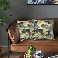 Velvet pillow covers with sage and khaki camouflage, styled on a sofa
