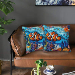 Velvet coastal pillow covers with clownfish and coral reef, styled in a living room