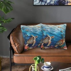 Velvet coastal pillow covers with sea turtles in blue water, styled in a living room