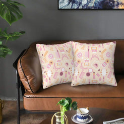 Velvet pillow covers with pink beauty accessories on cream, styled on a brown leather sofa