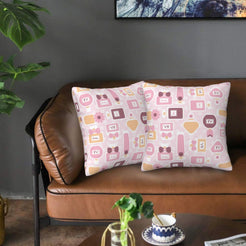 Velvet pillow covers with pink cosmetics and gift icons, styled on a brown leather sofa
