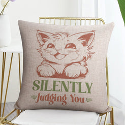 Linen-look pillow cover with cat and Silently Judging You quote, shown in a flat lay