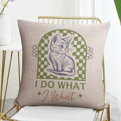 Linen-look pillow cover with cat and I Do What I Want quote, styled on a chair