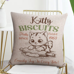 Linen-look pillow cover with Kitty Biscuits cat illustration, styled on a chair