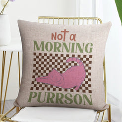 Linen-look pillow cover with Not a Morning Purrson cat illustration, styled on a chair