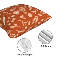 Hidden zipper and soft fabric detail on a rust botanical pillow cover