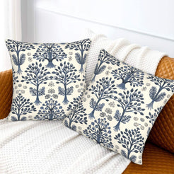 Block-print-inspired velvet pillow covers with navy tree-of-life gardens, styled on a sofa