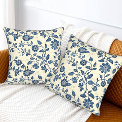 Block-print-inspired velvet pillow covers with navy small floral vines, styled on a sofa